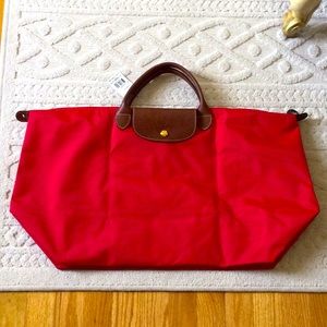 Longchamp red weekender bag never used